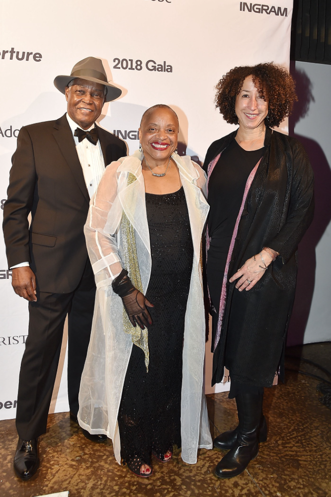 Cheryl Finley on the right, with Hank Thomas and Dr. Deborah Willis attending the 2018 Aperture Gala at Ceder Lake on October 30th, 2018 in NYC, Photo by Patrick Mullan via Getty Images.