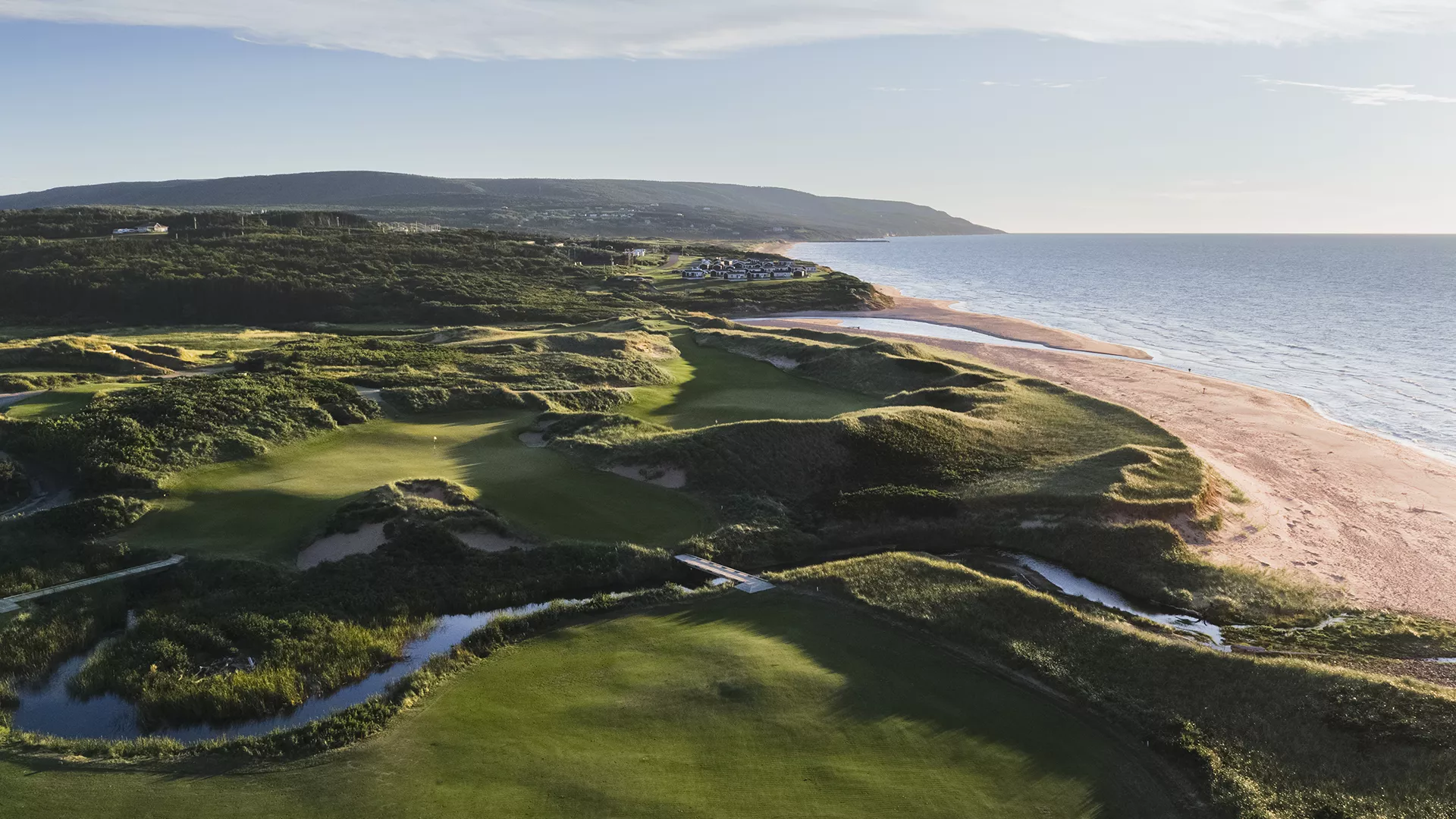 Golfers enjoying a course in Nova Scotia