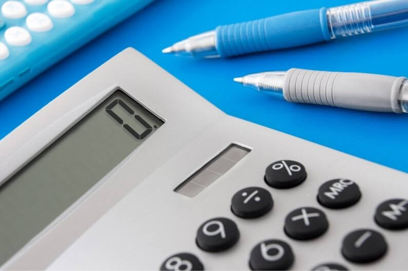 A calculator displays a value of zero.