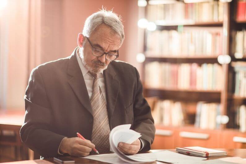 Attorney looks over franchise agreement for a client.