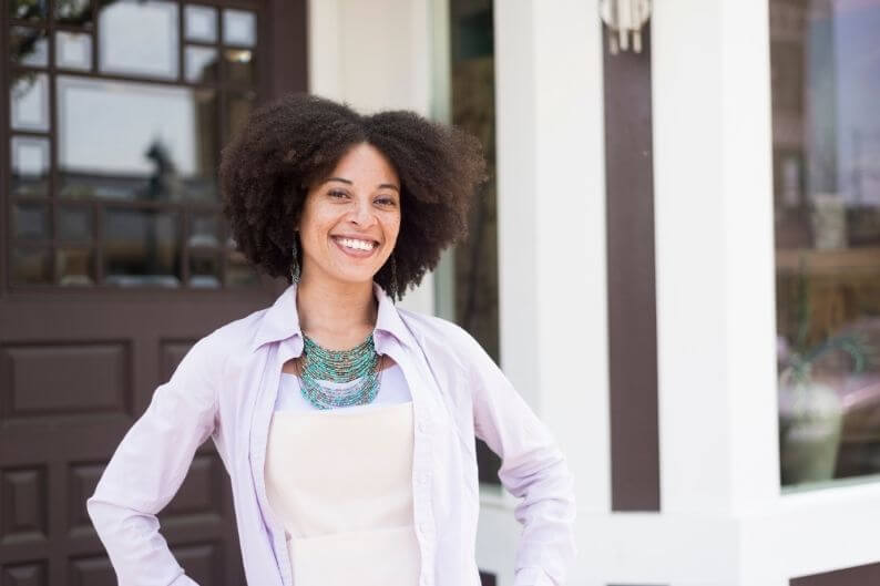 A female business owner celebrates her success.