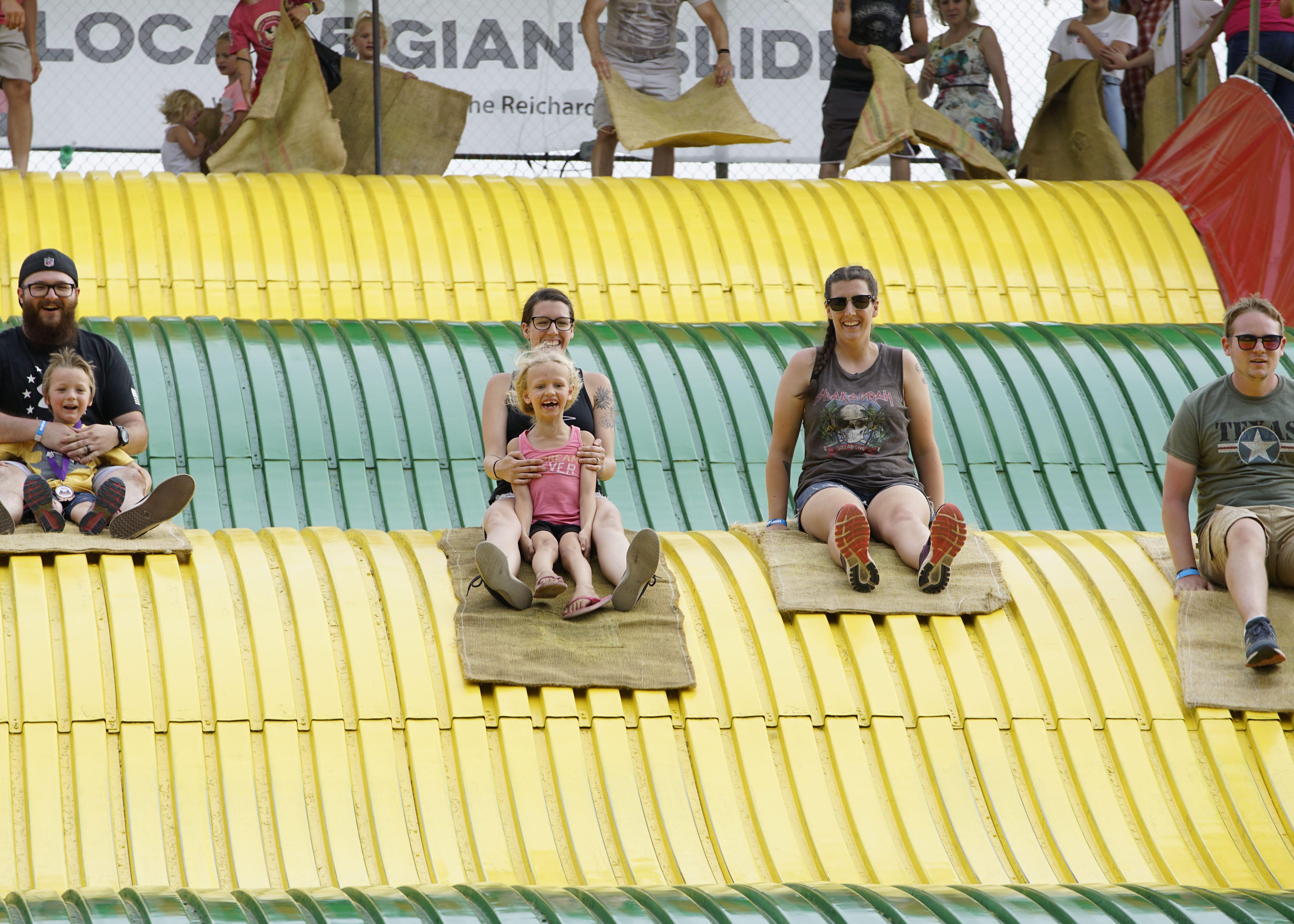 Fairgoers on the Giant Slide