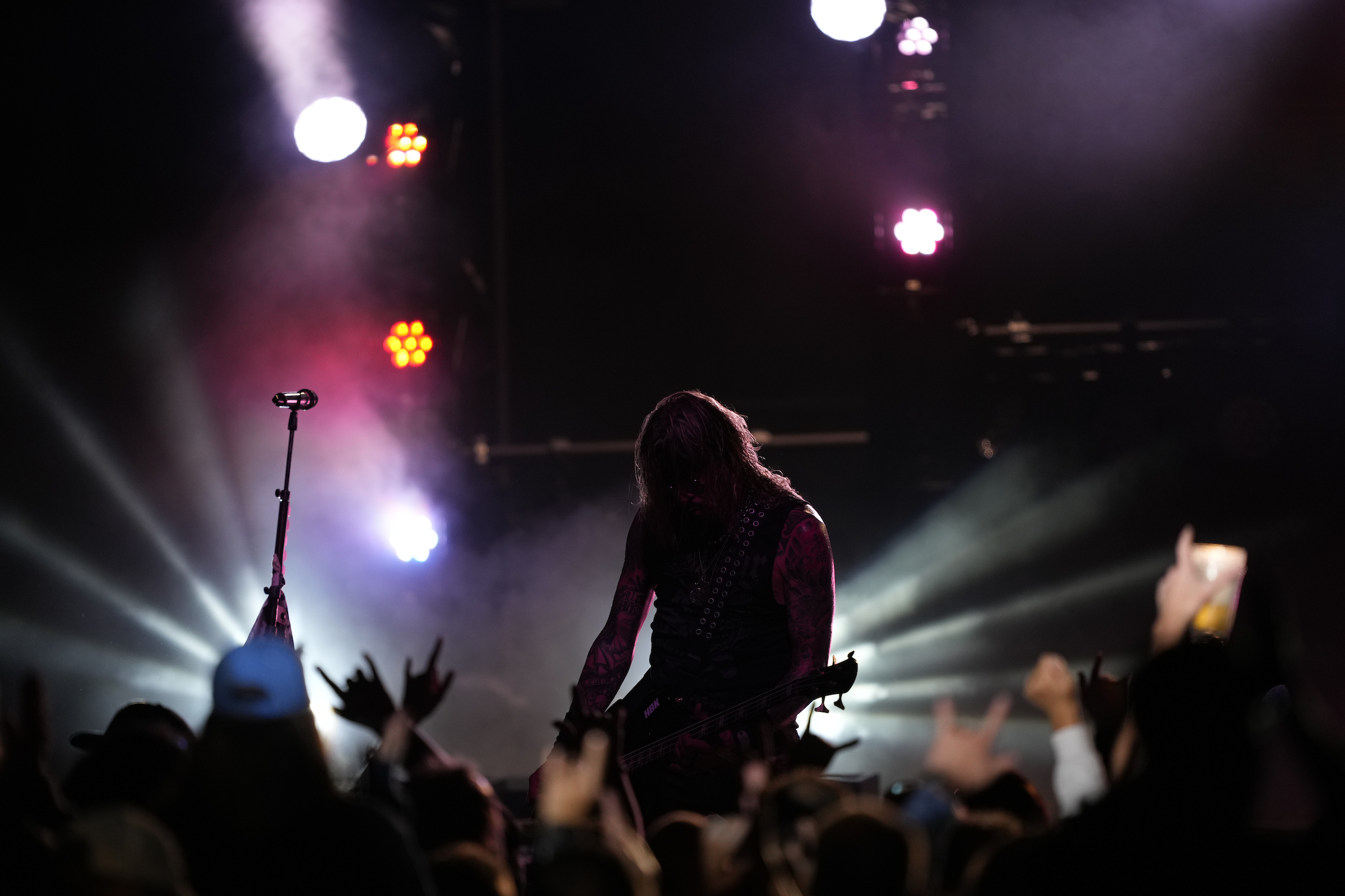 Man playing guitar in front of crowd