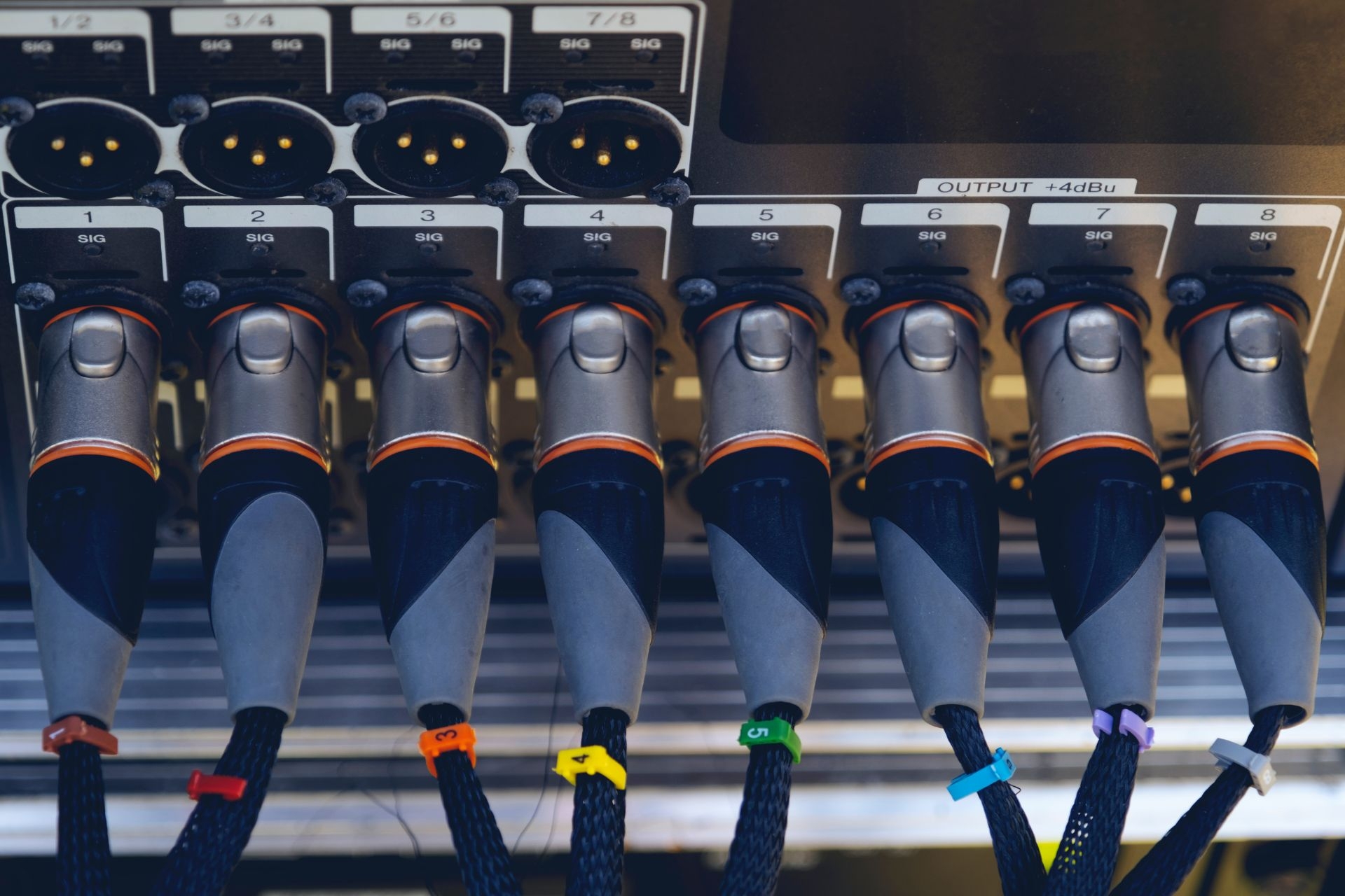 Are there any regulations or standards that dictate how alarm inputs should be configured in certain industries?
