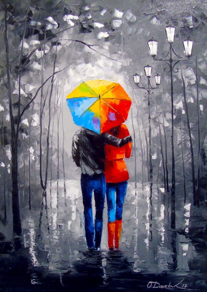 A couple walking under a brightly colored umbrella in a rainy, monochromatic park at night.