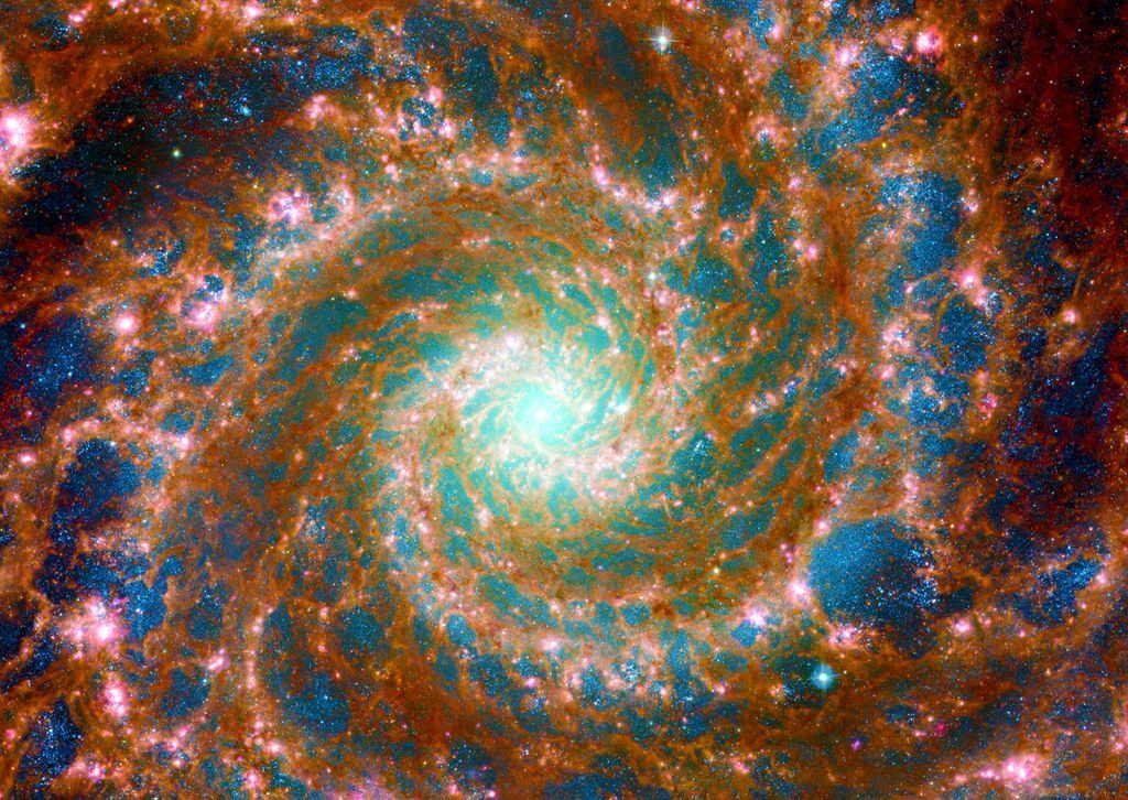 A vibrant spiral galaxy with a brilliant turquoise core and swirling orange and blue nebula clouds.