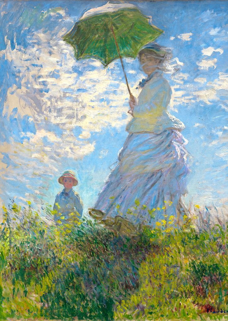 A woman holding a green parasol and a young boy stand in a sunlit, flowery meadow against a bright blue, cloudy sky.