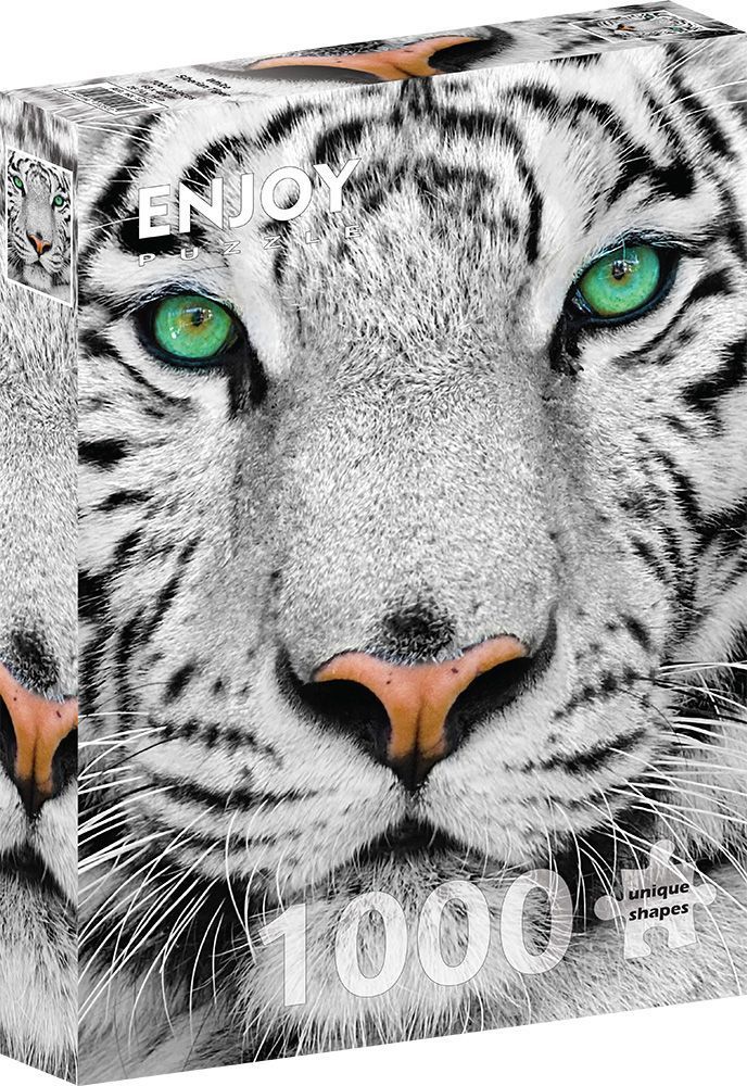 Close-up portrait of a white tiger with striking green eyes