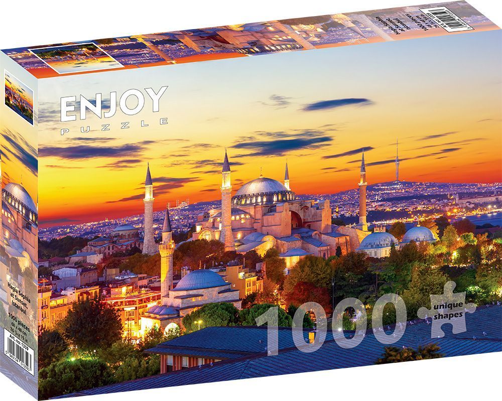 The Hagia Sophia in Istanbul at sunset, illuminated by a vibrant orange and yellow sky.