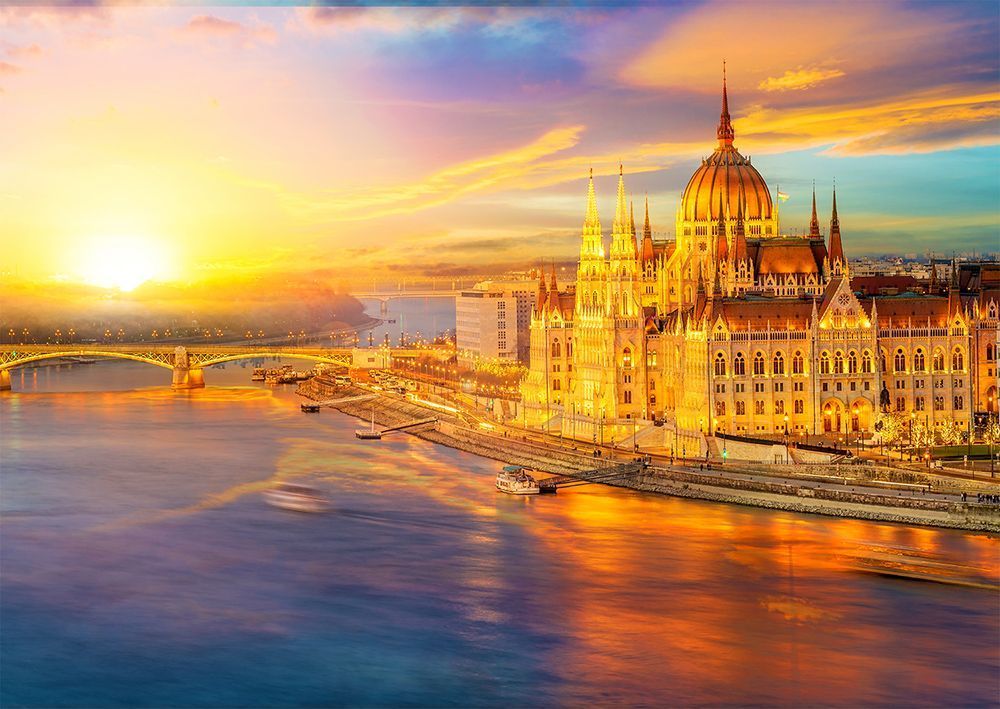 Golden sunset over the Hungarian Parliament Building on the banks of the Danube river