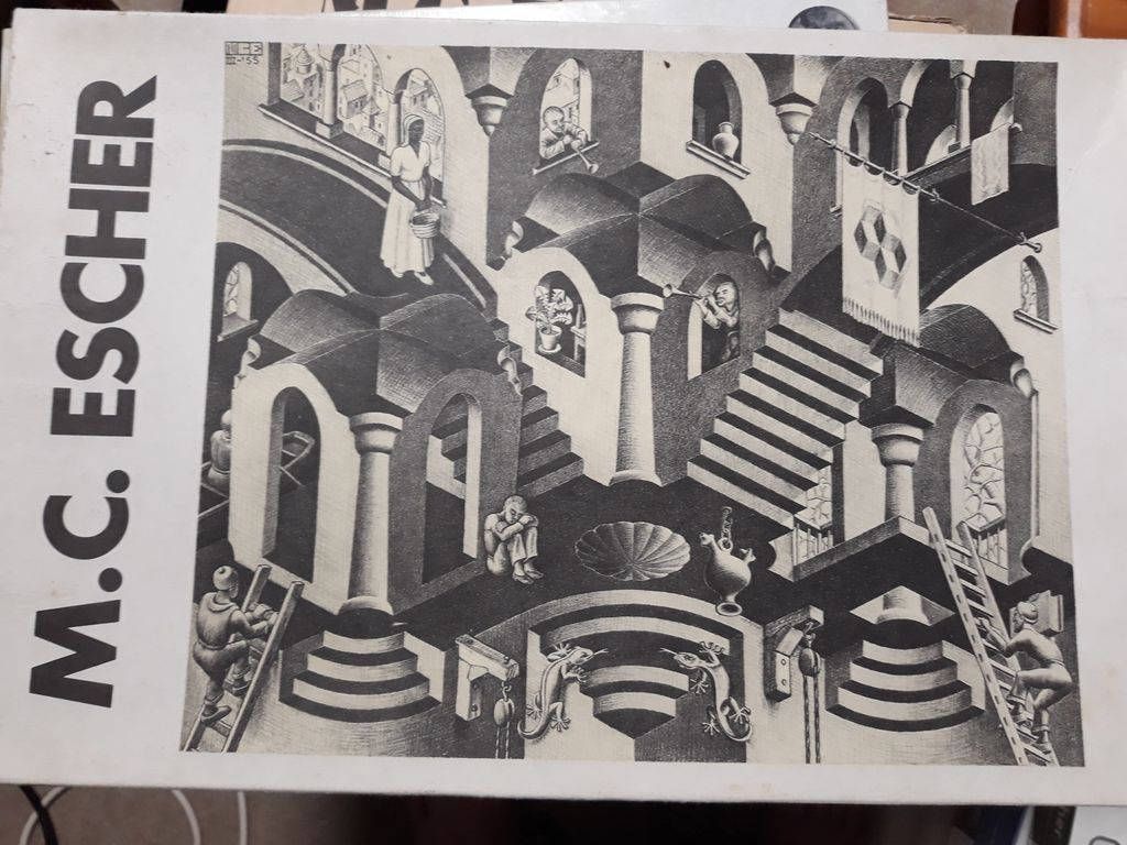 A black and white lithograph of an impossible architectural structure featuring staircases, arches, and human figures.