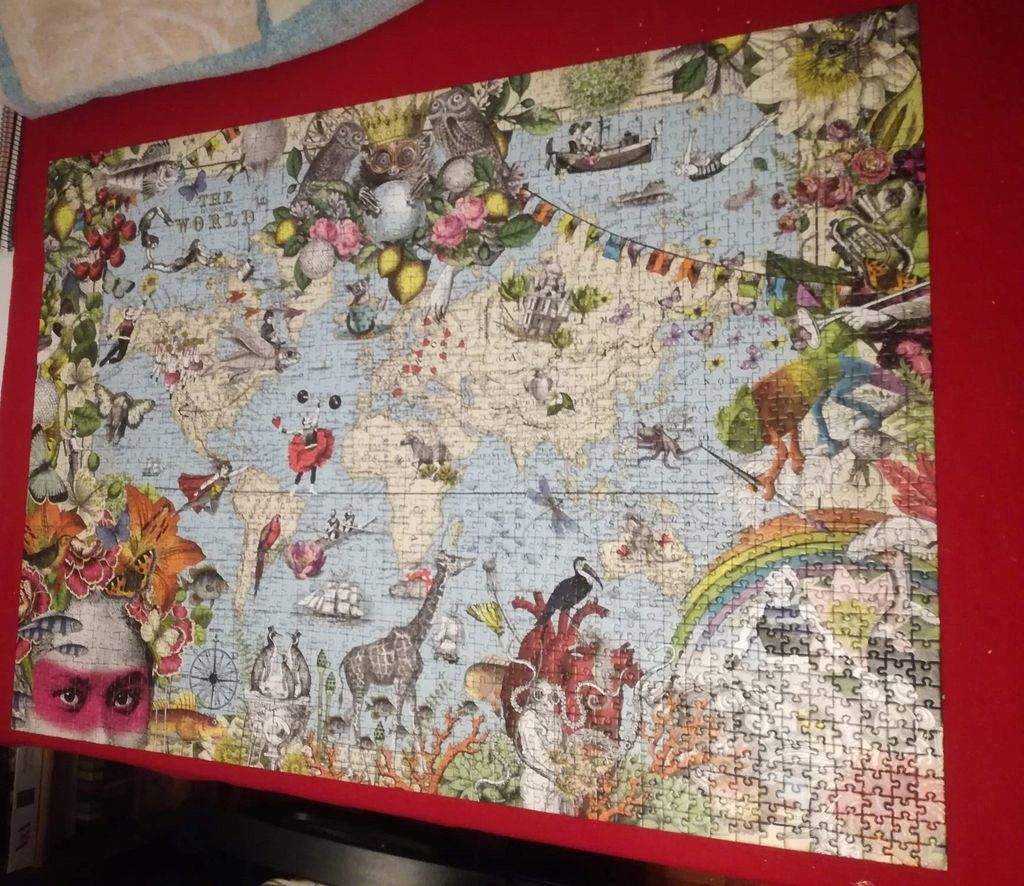 Whimsical, vintage-style illustrated world map with surreal floral, animal, and fantastical elements.