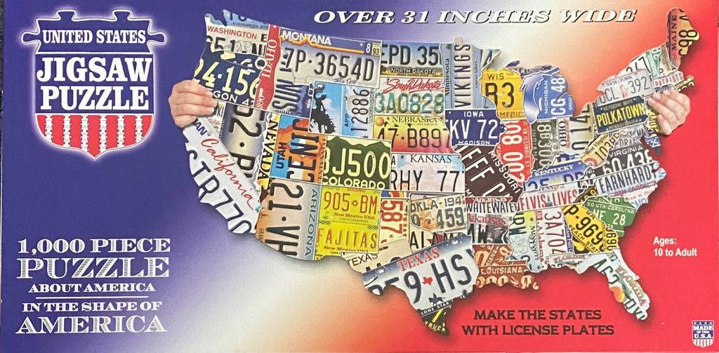 A collage of vintage US license plates arranged to form the geographic shape of the United States.