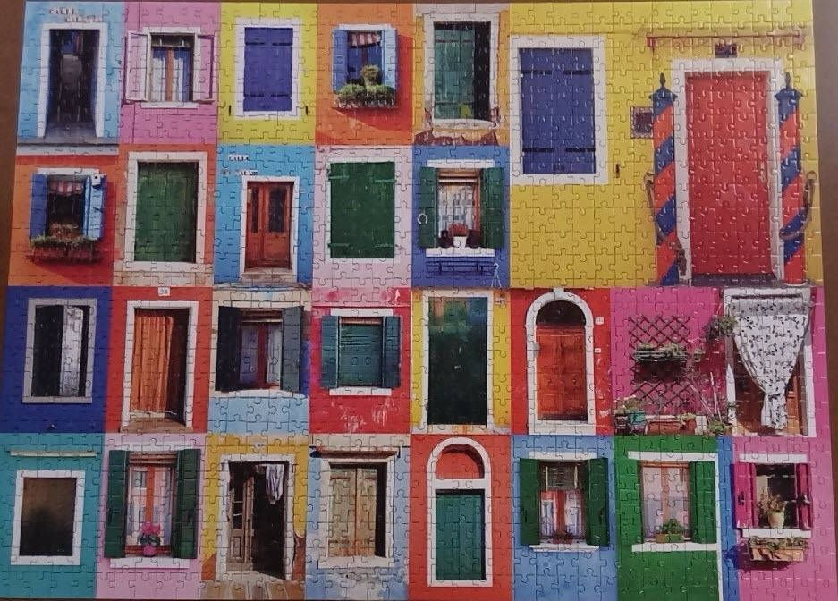 A collage of colorful Italian-style building facades featuring various doors and windows.