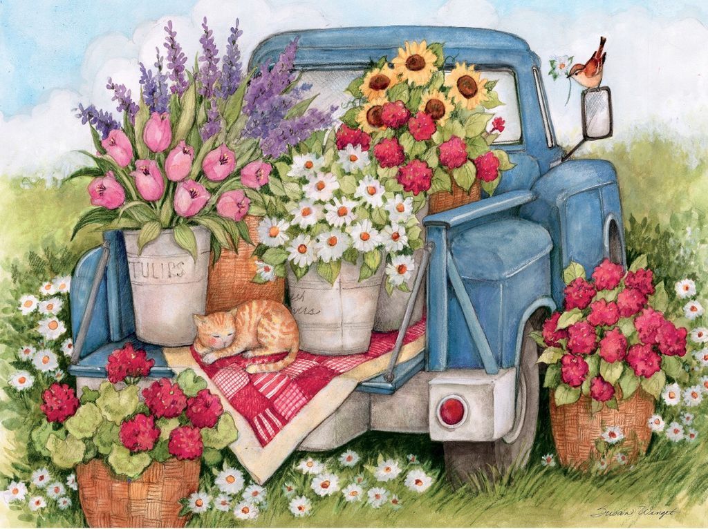 A blue vintage truck overflowing with flowers and a sleeping orange tabby cat in a pastoral setting.