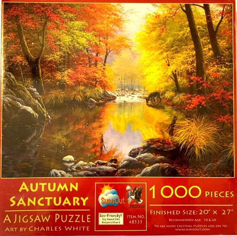A peaceful forest stream in autumn featuring vibrant yellow and red foliage, with a deer drinking from the water.