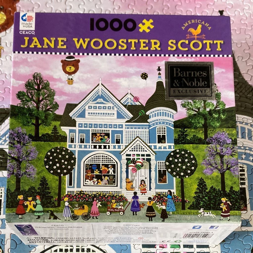 Folk art painting of a blue Victorian house decorated with teddy bears and balloons, surrounded by children in a garden.