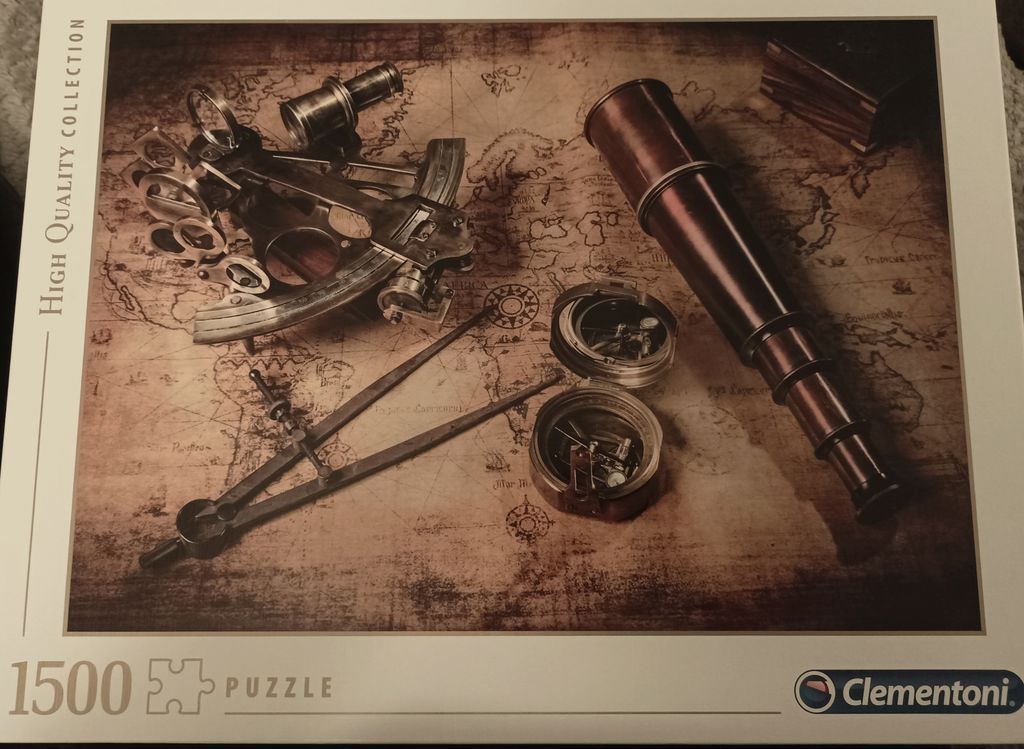 Vintage navigation tools including a brass telescope, sextant, and compass resting on an antique map.