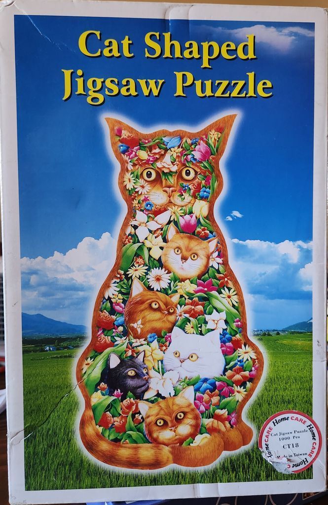 A whimsical illustration of a cat-shaped silhouette filled with smaller cat faces and vibrant flowers against a blue sky.