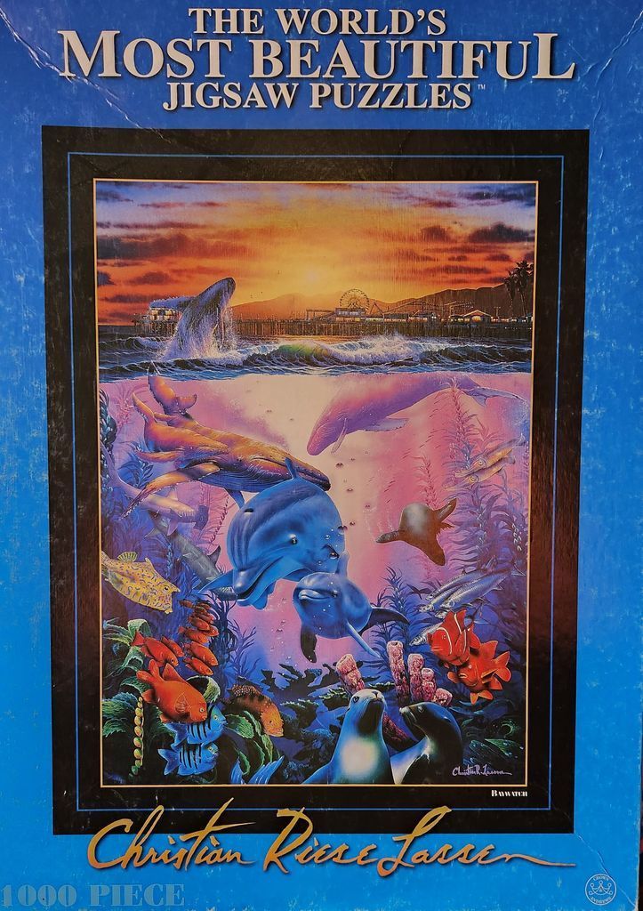 Underwater scene with dolphins, whales, and seals beneath a coastal pier at sunset.