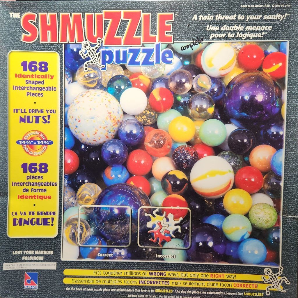 A close-up photograph of a large collection of colorful glass marbles of various sizes and patterns.