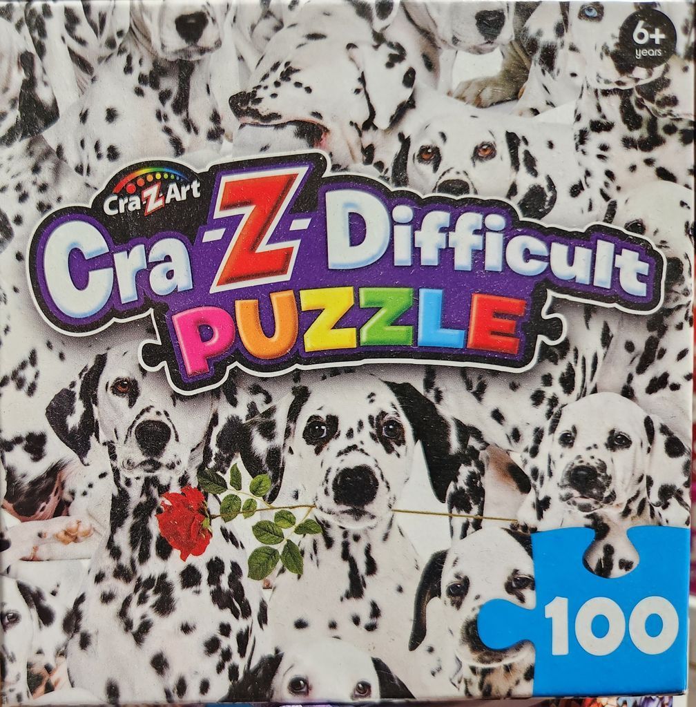 A collage of multiple Dalmatian puppies in black and white with a single red rose.