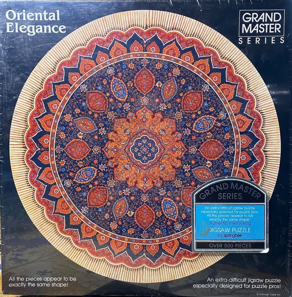 A circular ornamental rug design featuring intricate Persian-style floral patterns in deep blue, red, and cream.