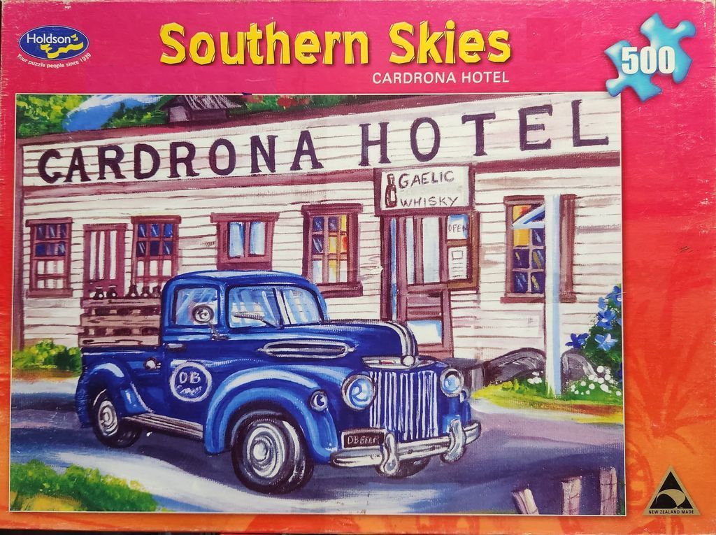 Painting of a vintage blue truck parked in front of the historic Cardrona Hotel.