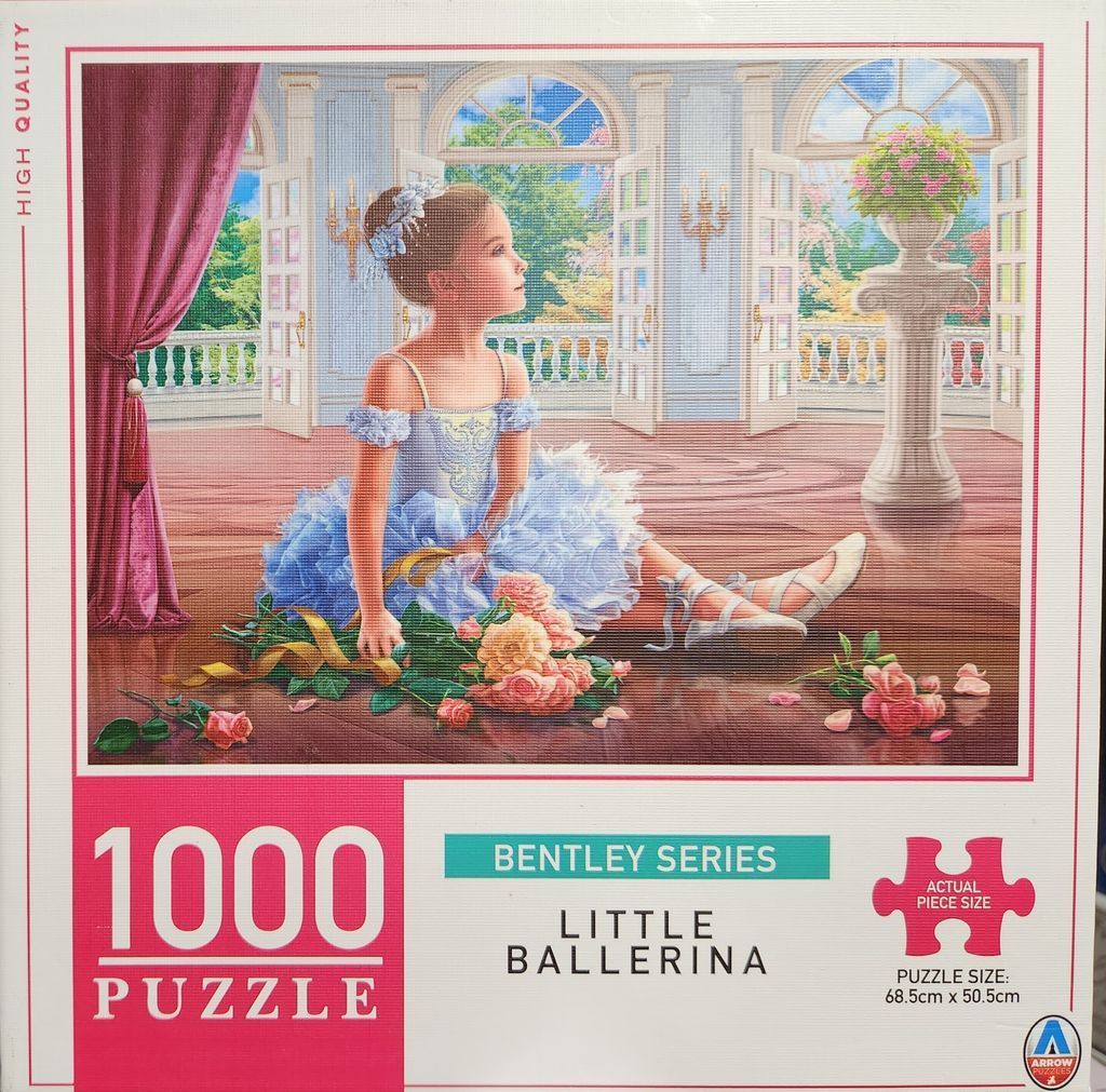 A young ballerina in a blue tutu sits on a wooden floor in a grand room with open French doors and flowers.