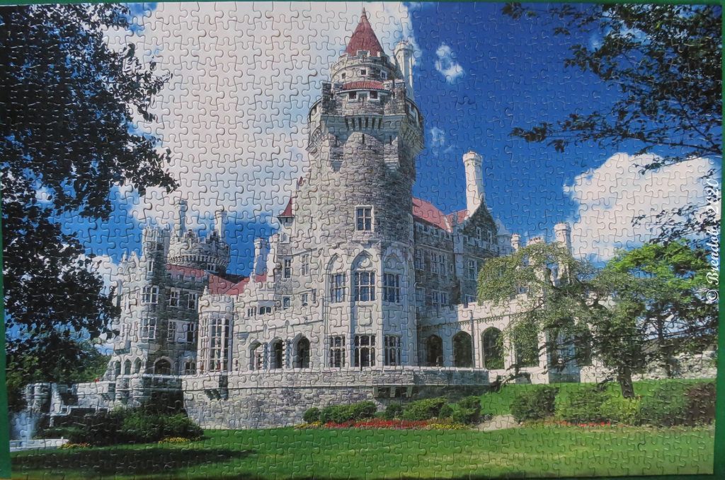 Casa Loma castle in Toronto with a tall turret against a clear blue sky