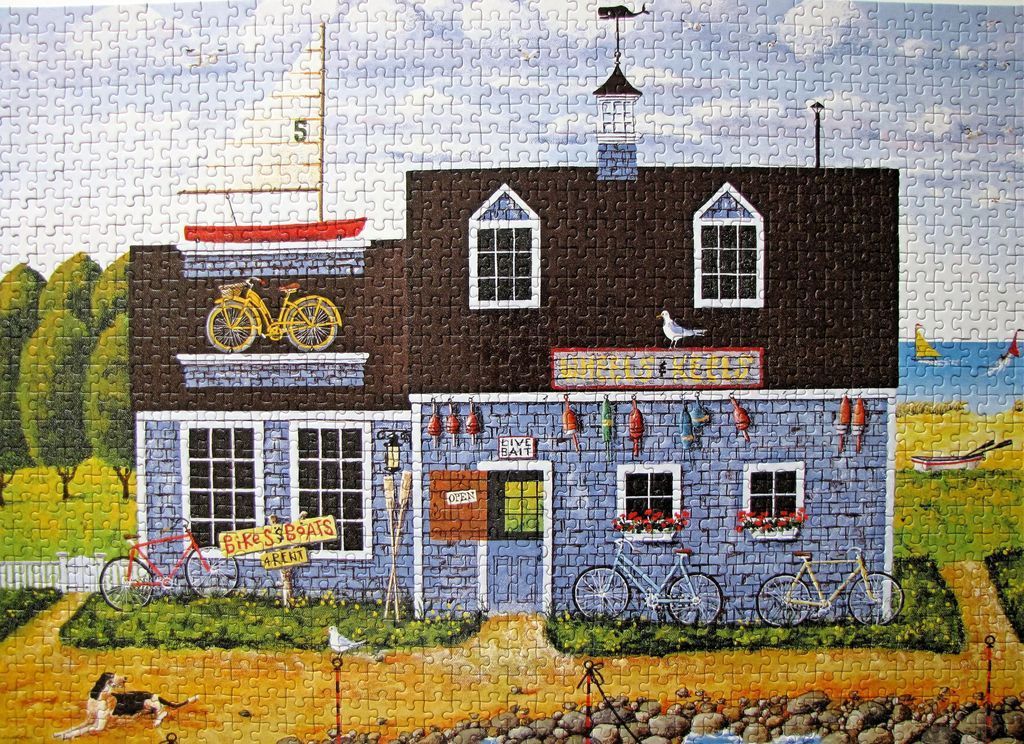 A whimsical illustration of a coastal bait and rental shop featuring bicycles, a boat on the roof, and a dog.