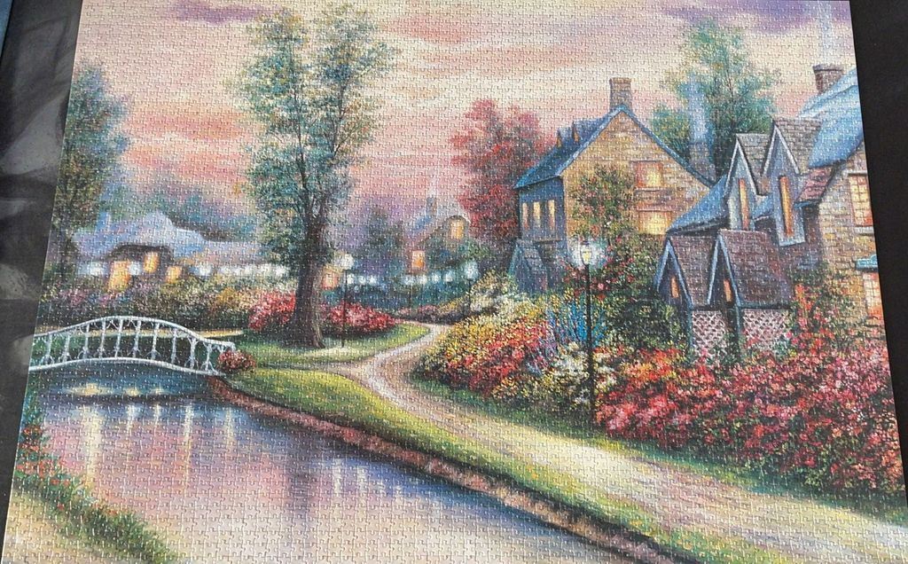 A peaceful oil painting of a garden cottage at twilight with a bridge over a canal.