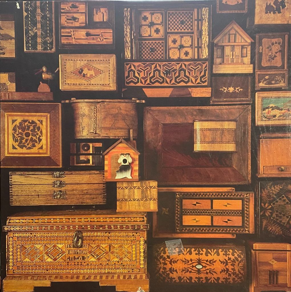 A collage of antique wooden marquetry boxes, chests, and decorative cabinets in various shapes and patterns.