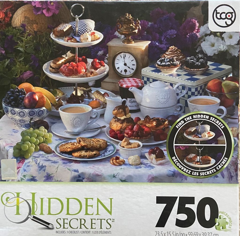 A lush garden table set for afternoon tea with pastries, fresh fruit, and vintage decor.