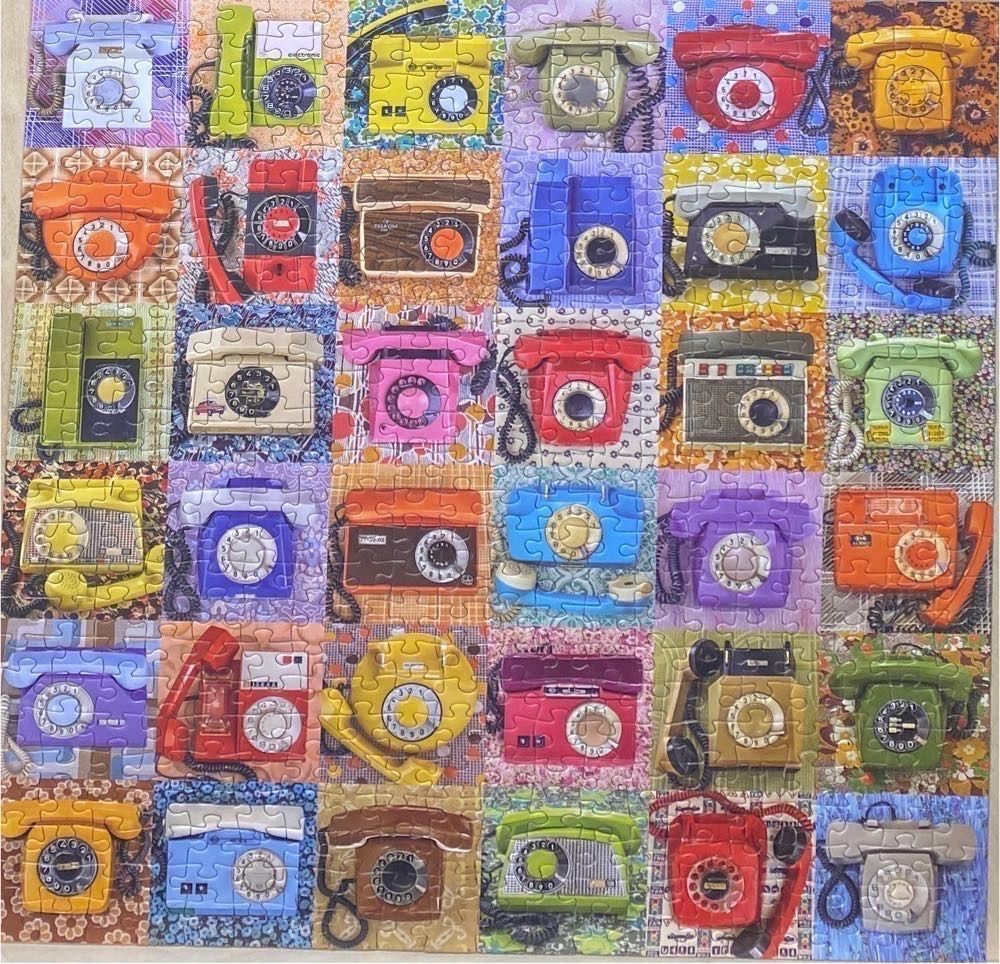 A grid of vintage rotary telephones in various colours and styles against patterned backgrounds.