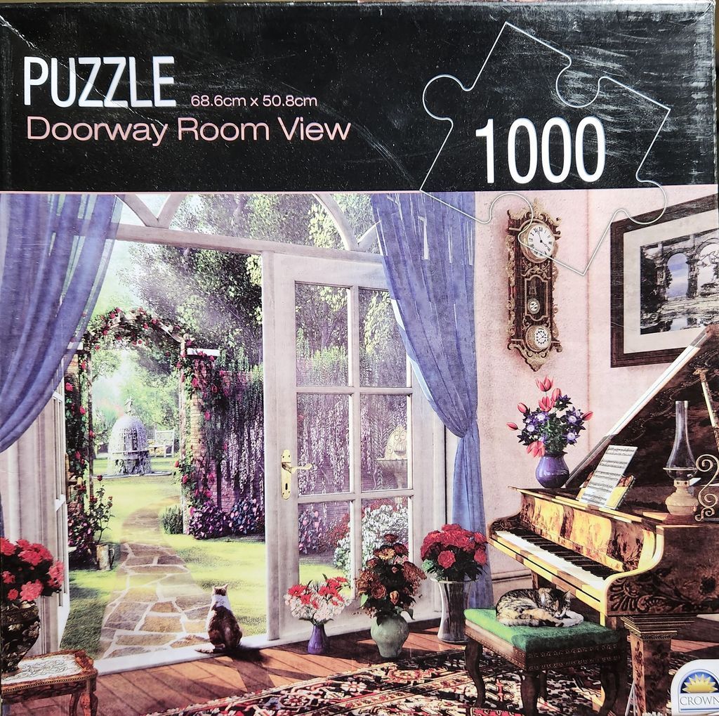 A cozy interior room opening onto a lush garden with a cat sitting in the doorway and another on a piano bench.