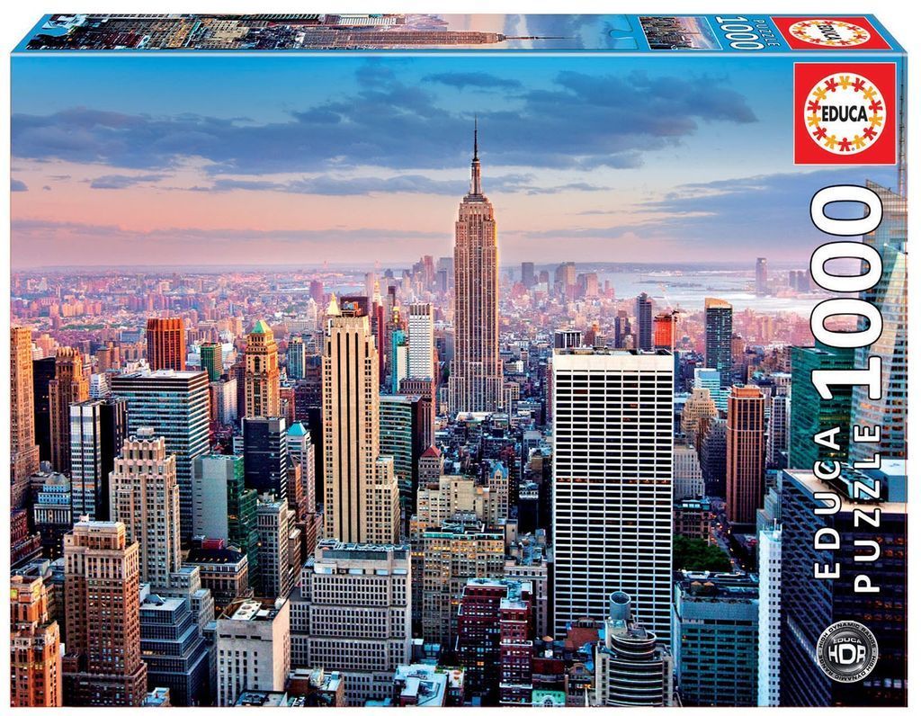 Aerial view of the New York City skyline at sunset featuring the Empire State Building.