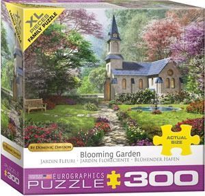 A peaceful stone chapel surrounded by a blooming spring garden with flowering trees and a stone path.