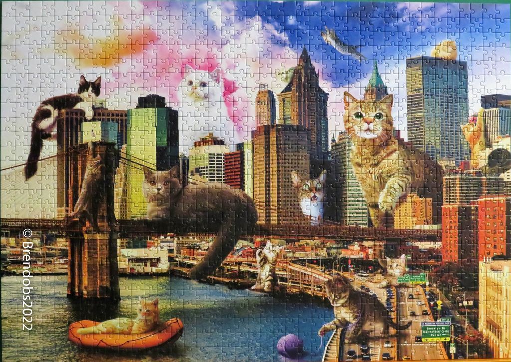 Surreal composite image of giant cats integrated into a New York City skyline scene with the Brooklyn Bridge.