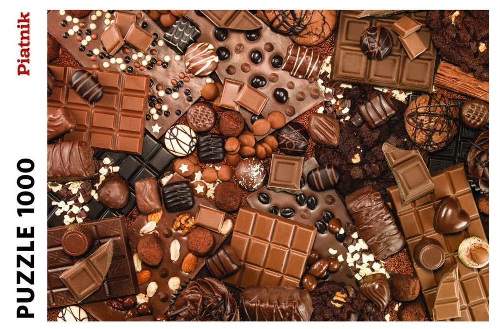 A top-down view of a chaotic assortment of chocolates, including bars, truffles, and cookies.
