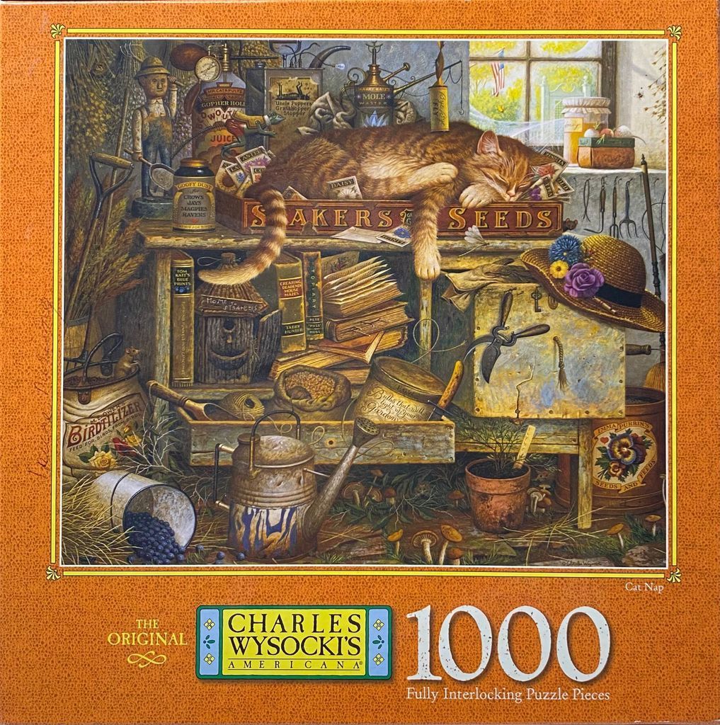 A tabby cat napping on a wooden seed box in a rustic garden shed filled with gardening tools and supplies.