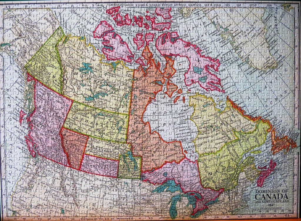 A vintage-style map of the Dominion of Canada in 1867 with varied pastel color-coded provinces.
