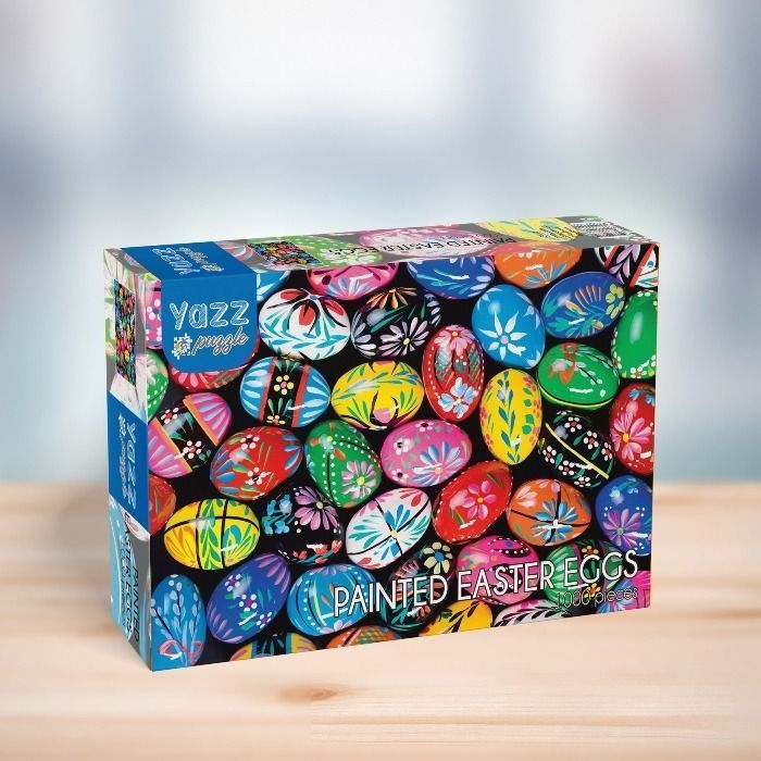 Close-up of numerous vibrantly painted Easter eggs with intricate floral patterns against a black background.