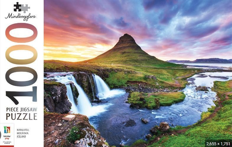 Kirkjufell mountain and waterfall in Iceland under a vibrant sunset sky.