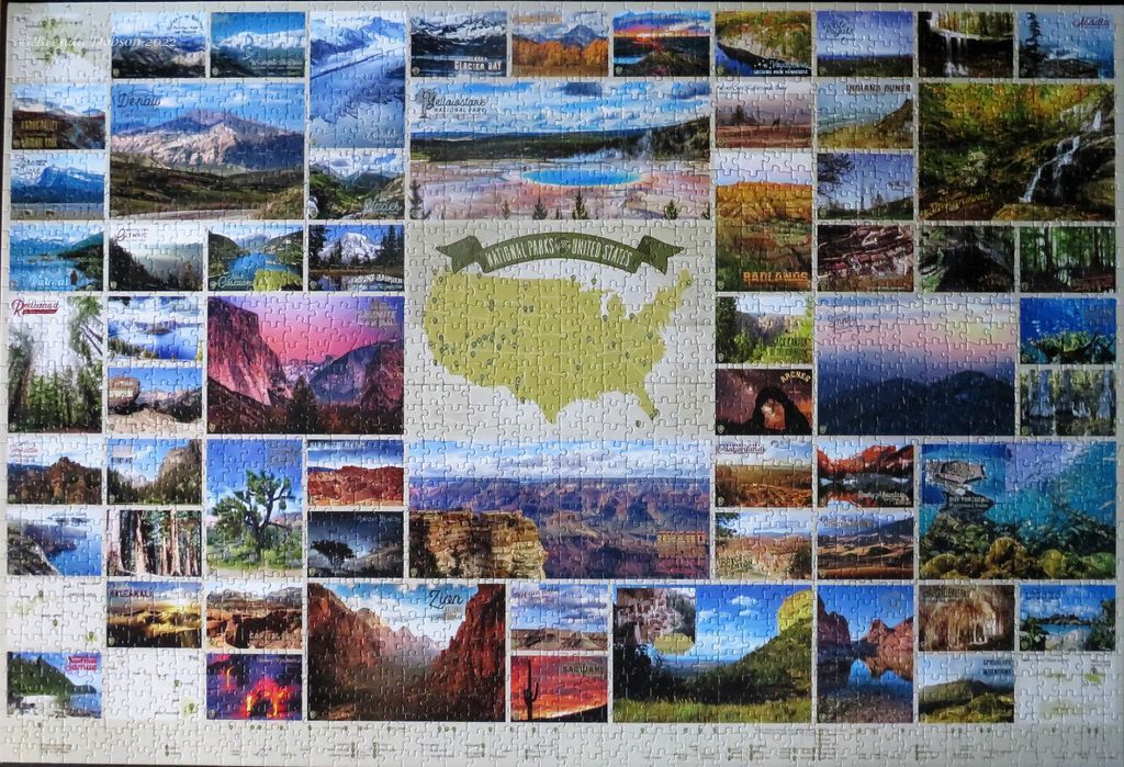 A map of the United States surrounded by a collage of 50 different national park photographs.