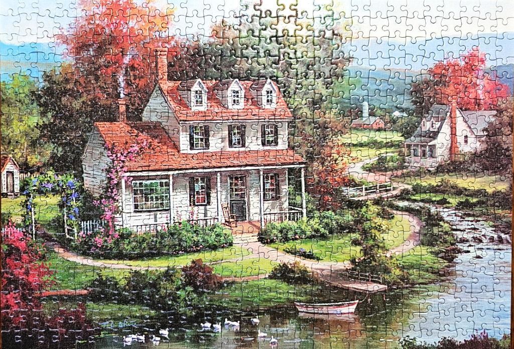 A peaceful painting of a two-story white farmhouse by a stream with autumn trees.