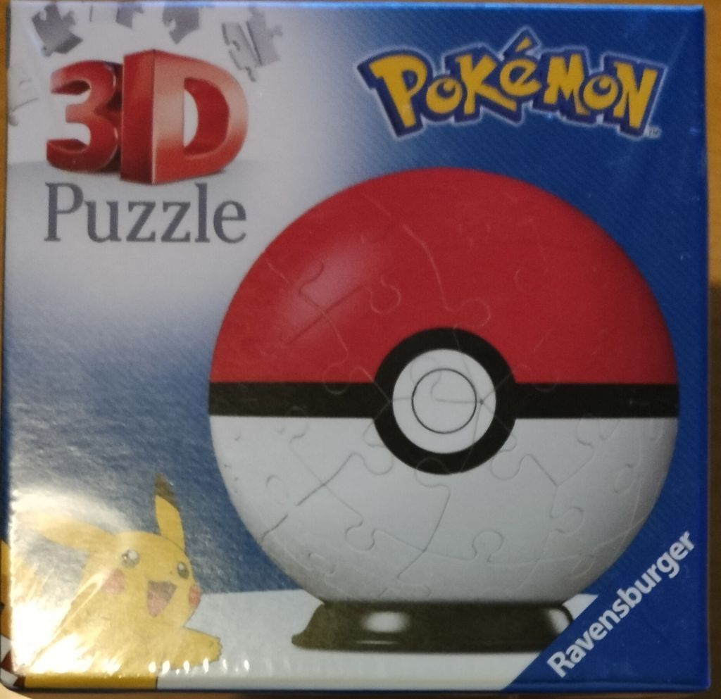 A spherical Poke Ball resting on a small black stand, with a Pikachu illustration in the corner.