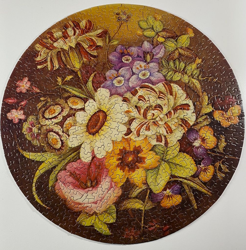 A circular illustration of a lush, vintage-style floral bouquet in warm, earthy tones.
