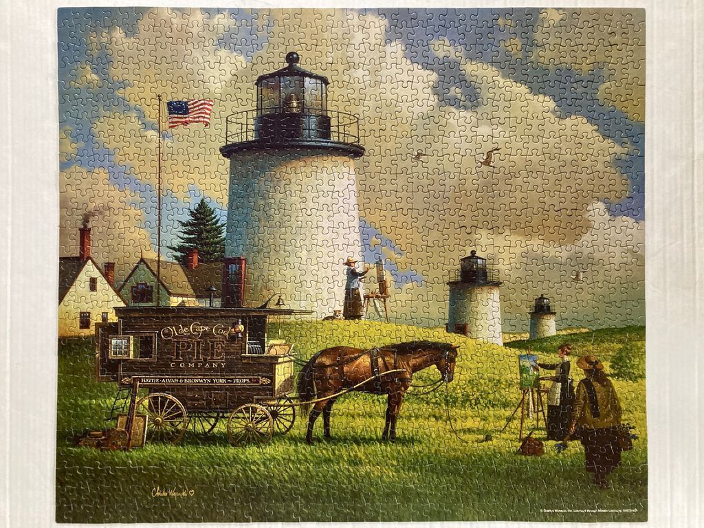 An Americana-style illustration of a large white lighthouse, a horse-drawn pie wagon, and artists painting in a field.