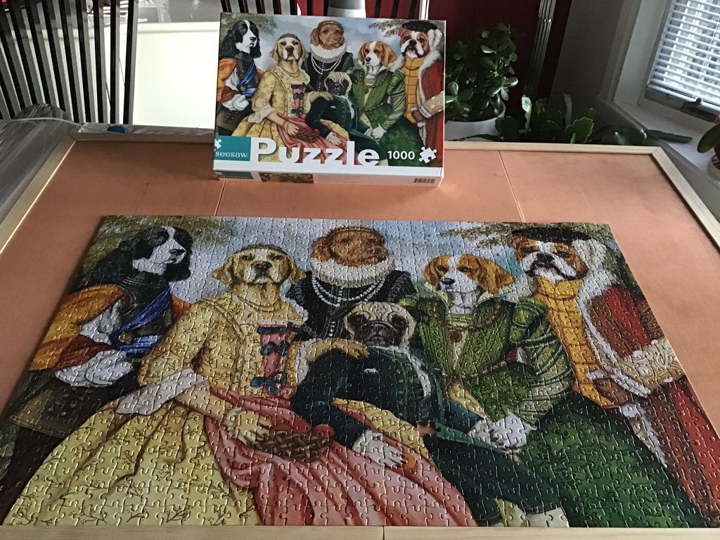 A whimsical painting of a group of six dogs dressed in elaborate Renaissance-era royal costumes and gowns.
